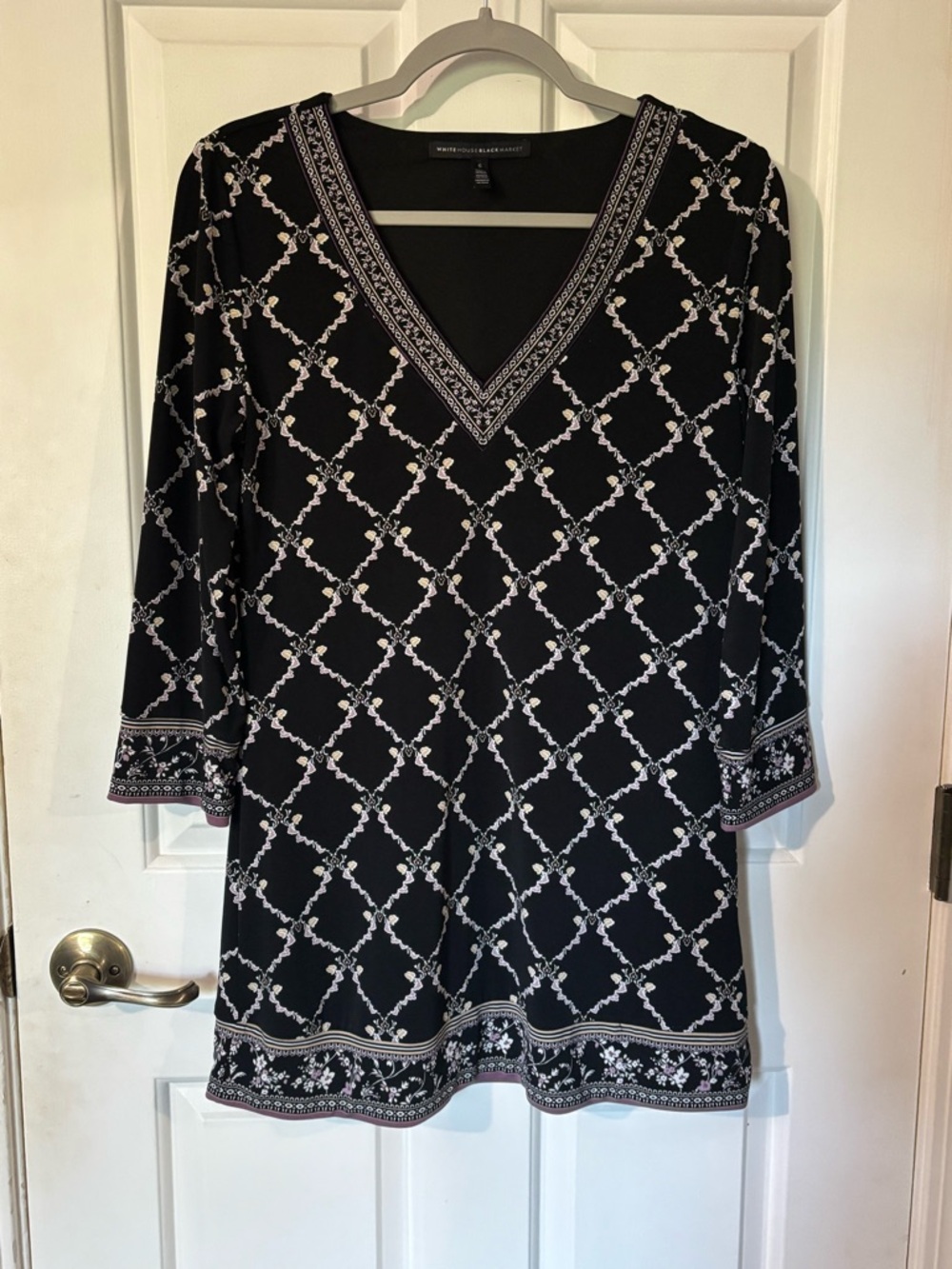 White House Black Market Black & White V-Neck Tunic Top. Light purple accents.